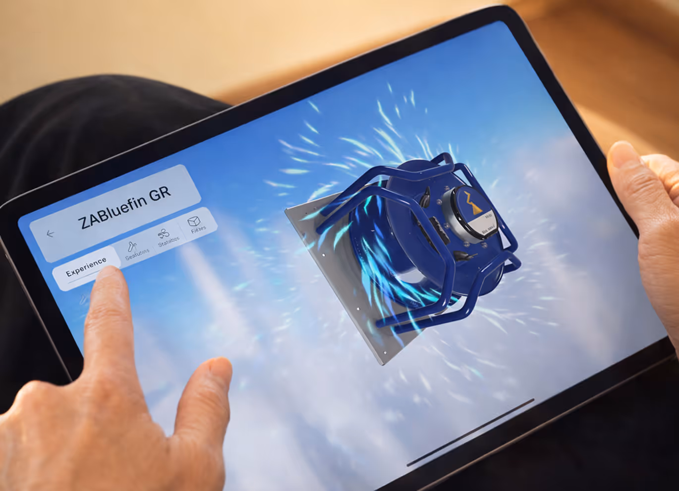 Person using a tablet showing a blue mechanical device labelled ZABluefin GR with interface options including Experience, Sealings, Statistics, and Filters.