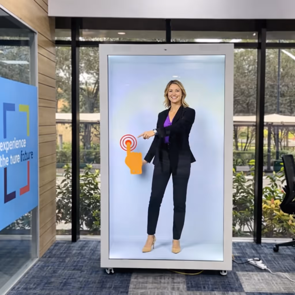 Woman in business attire standing inside a large digital screen kiosk, pointing at a red target icon with an orange hand symbol.