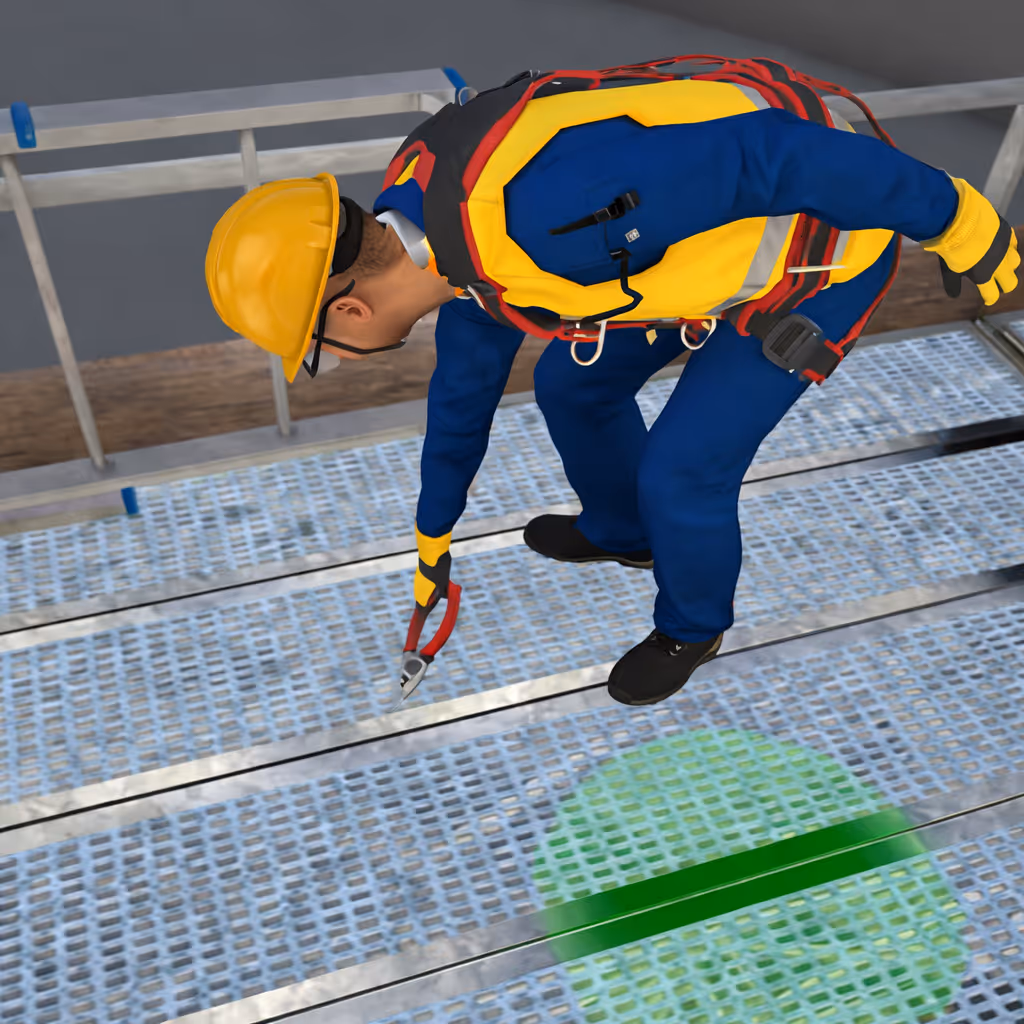 Construction worker wearing a yellow hard hat and safety vest using pliers on metal grating scaffolding.