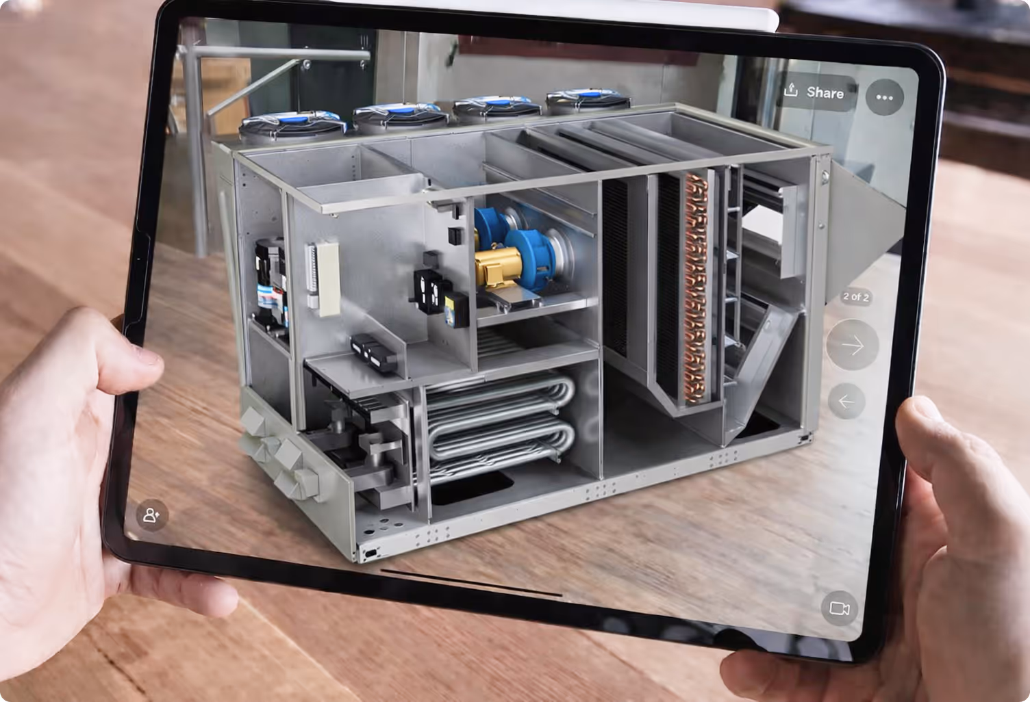 Sales professional using AR tablet to place full-size HVAC unit in client facility