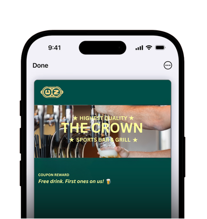 Mobile phone screen showing a coupon for The Crown Sports Bar & Grill offering a free first drink.