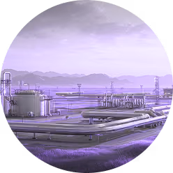 Industrial oil refinery with storage tanks and pipelines under a cloudy sky in a mountainous area.