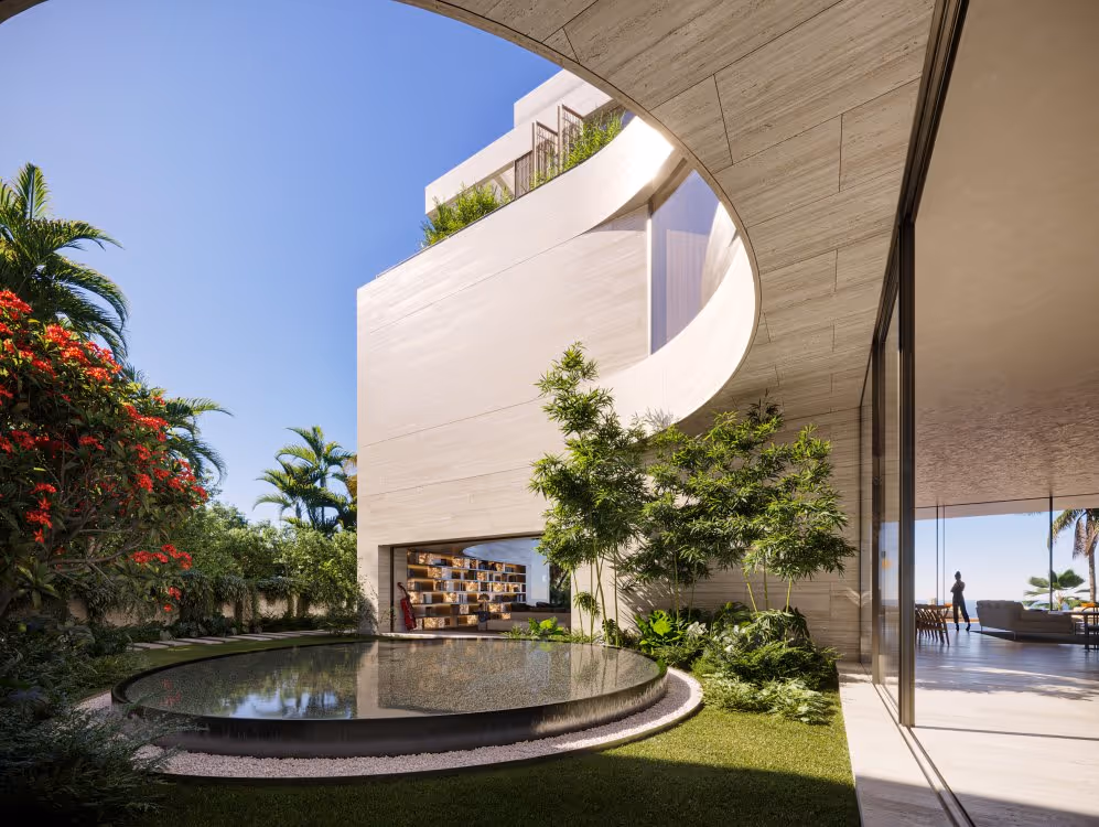 Curved white building with reflective pool, tropical gardens, and open terraces.