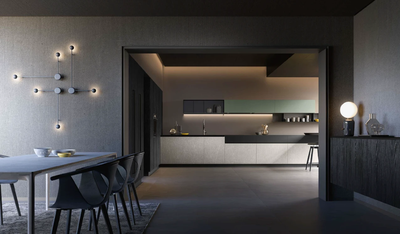 Espace repas contemporain avec table et chaises noires s'ouvrant sur une cuisine moderne aux teintes sombres – renovation cuisine toulouse