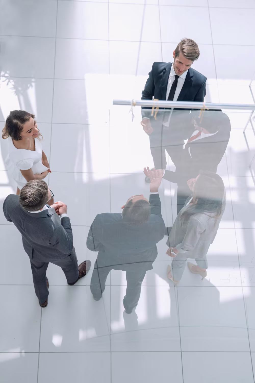 Business professionals seen from above in a modern corporate lobby