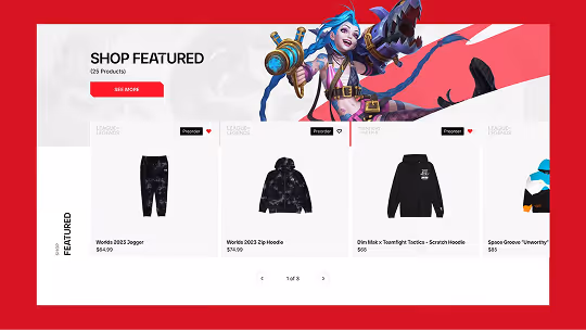 Online shop featuring five League of Legends apparel items including joggers, hoodies, track jackets, and a beanie, with vibrant character artwork above.