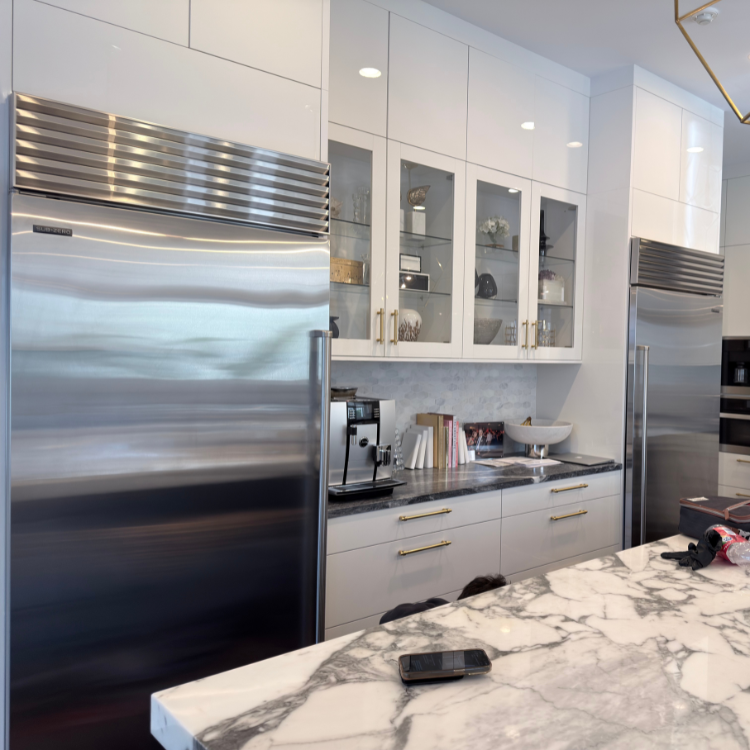 image of plumber working under a sink