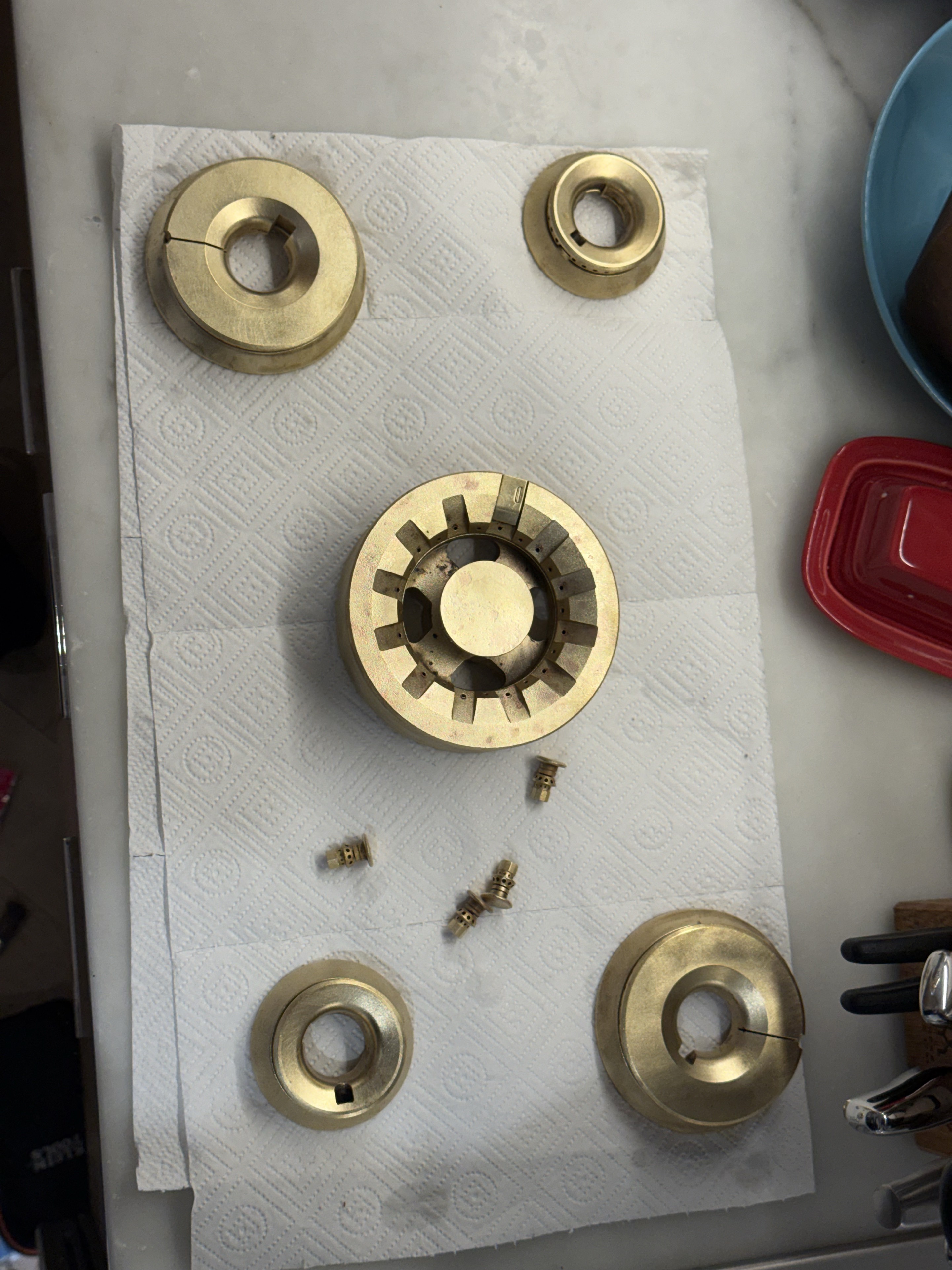 Brighter removable burner components laid out during professional service