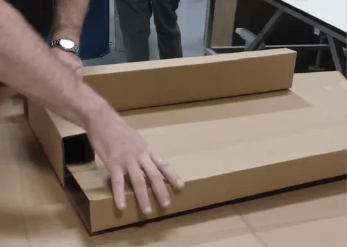 InterMetro employee is folding Packsize box.