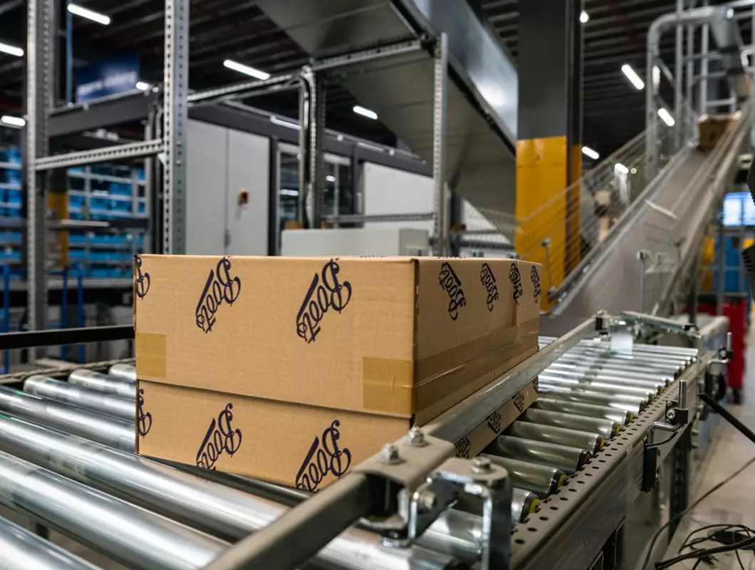 Right-sized Boots package on a conveyor belt, ready for delivery.