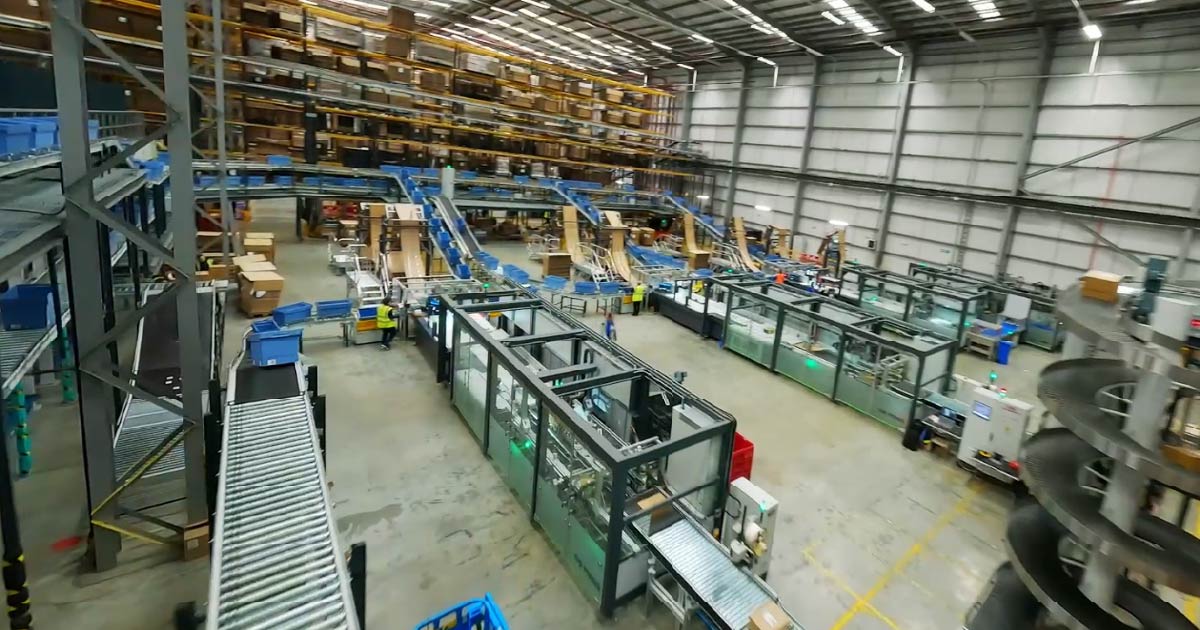 fulfillment center with packaging machines on the floor
