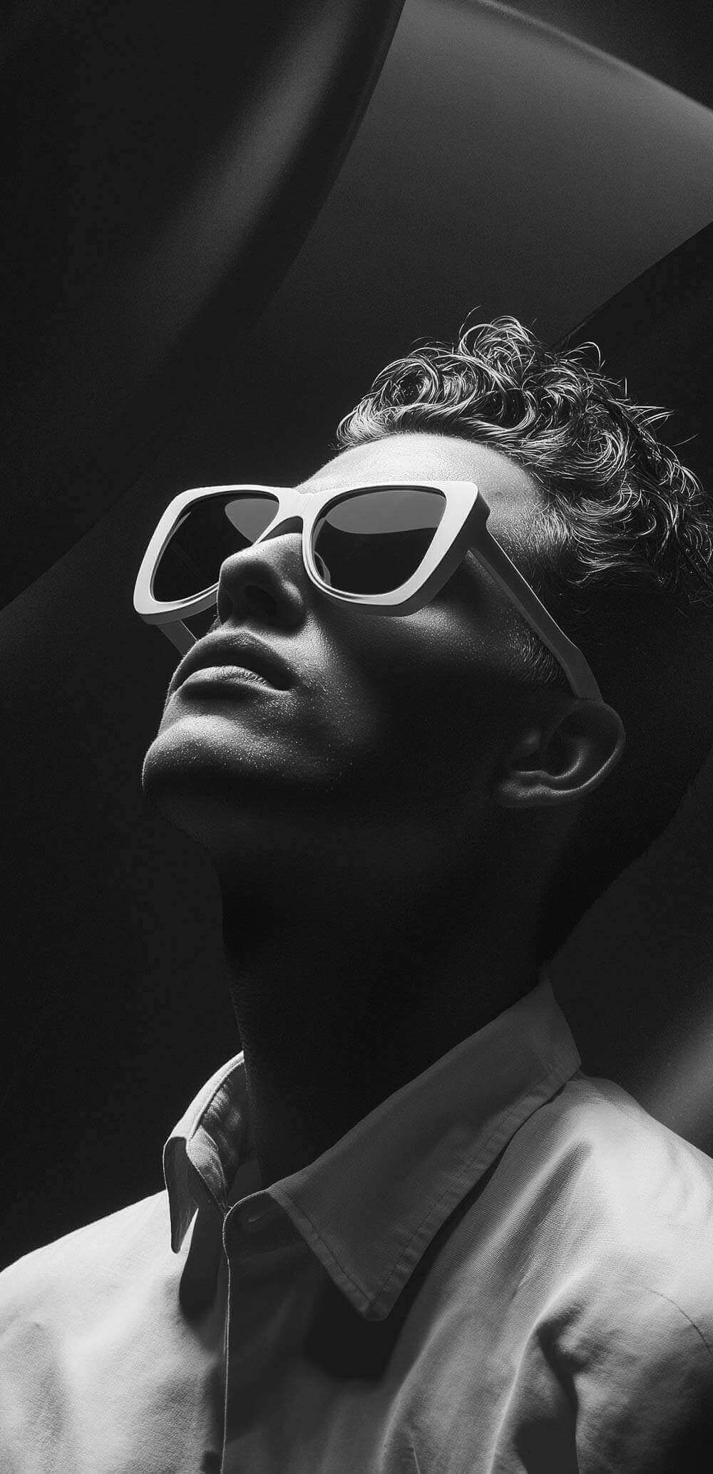 Portrait of a man in the white sunglasses.