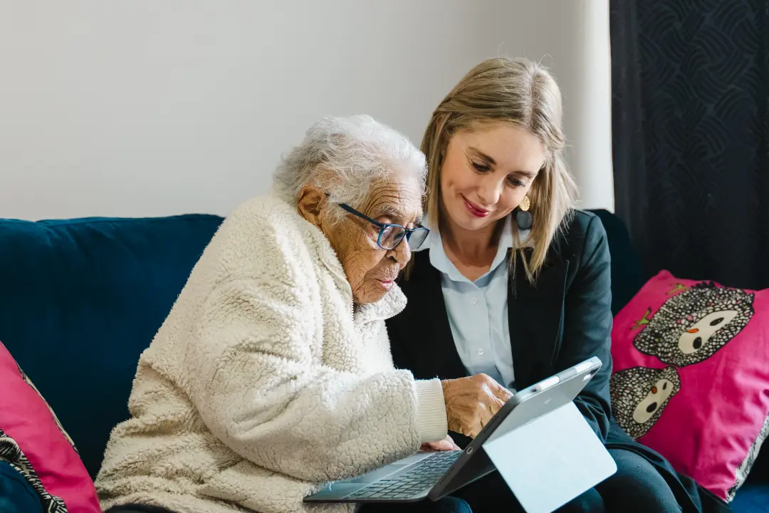 Lisa helping an aged care client with Support at Home budget