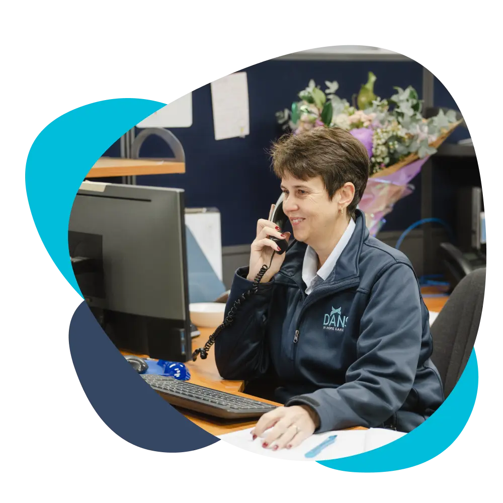 DANS team member answering the phone call of an aged care client