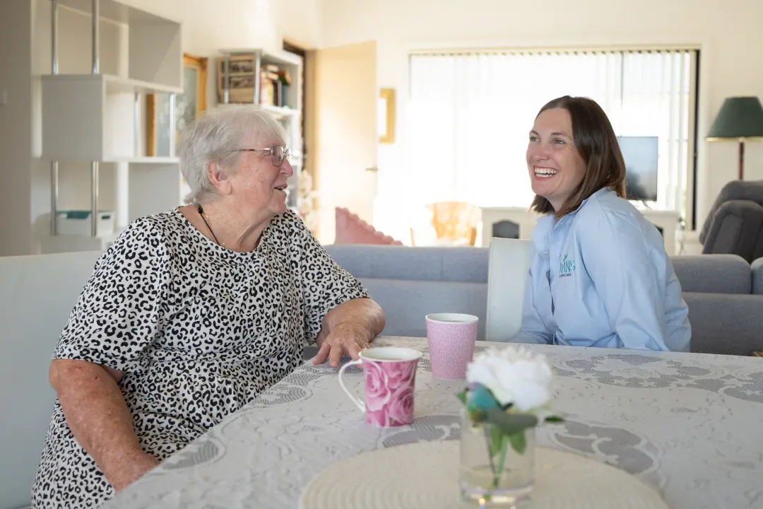 Jacqui talking with one of our longest serving aged care clients at home