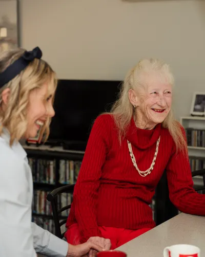 Aged care client laughing with the team at DANS