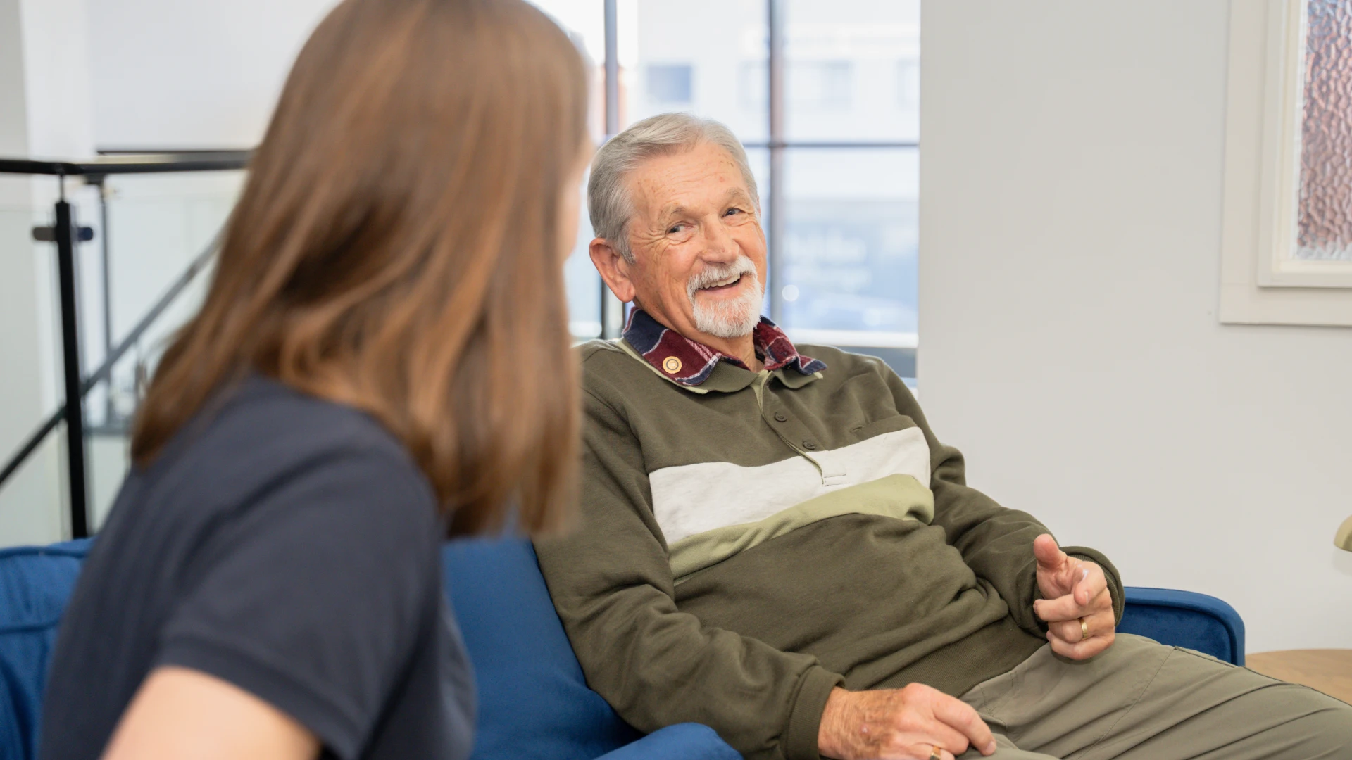 Care worker and client talking and laughing