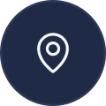 White location pin icon centered on a dark blue circular background.