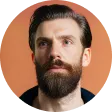 A man with a goatee and a beard.
