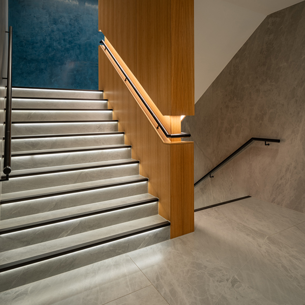 Blurred green surface with horizontal lines and a light gradient background.