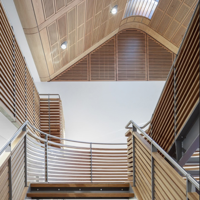 Website blog page featuring large 'Blogs' text, navigation menu, and previews of blog posts with abstract images and titles about design and development.