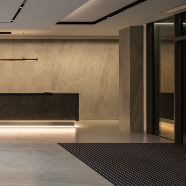 Website blog page featuring large 'Blogs' text, navigation menu, and previews of blog posts with abstract images and titles about design and development.