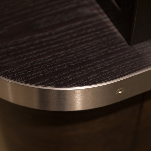 Blurred green surface with horizontal lines and a light gradient background.