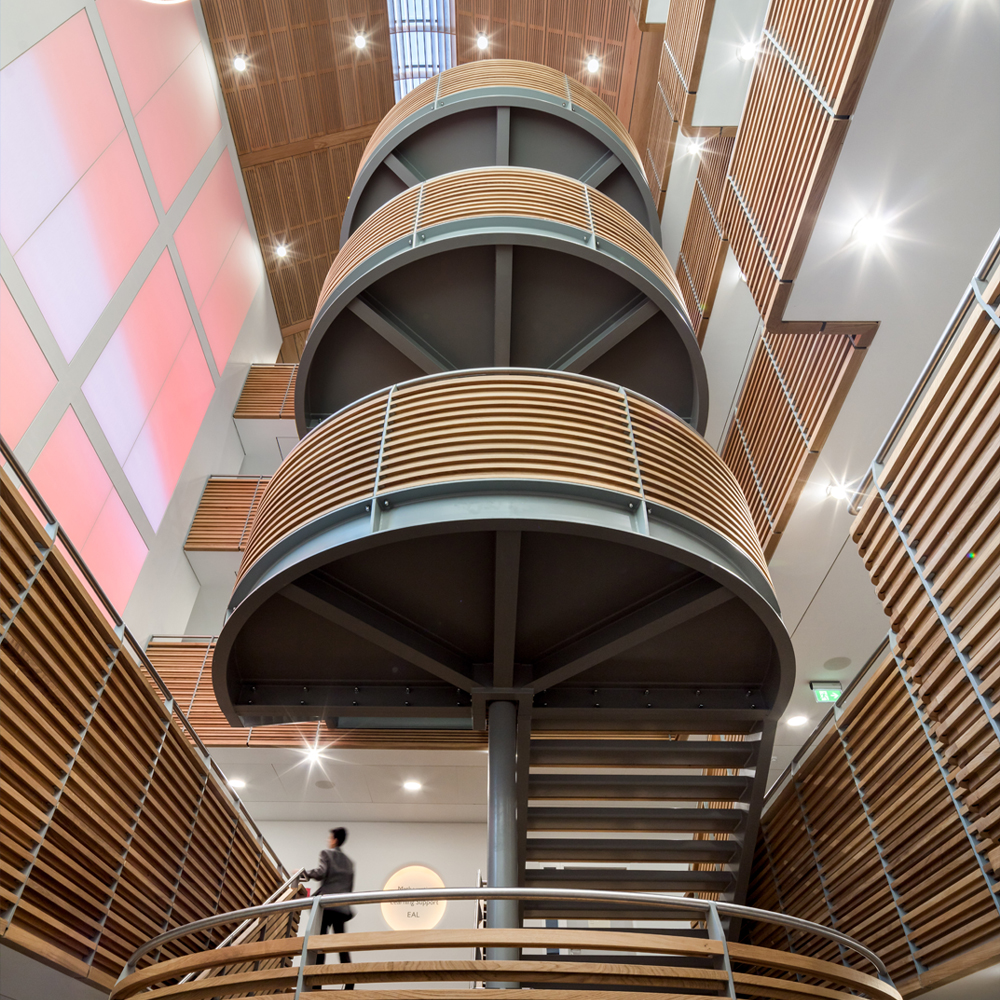 Abstract wavy lines gradient in yellow and orange on a soft blue-gray background.