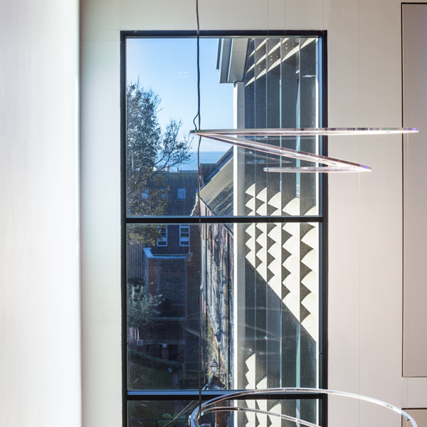 Website blog page featuring large 'Blogs' text, navigation menu, and previews of blog posts with abstract images and titles about design and development.