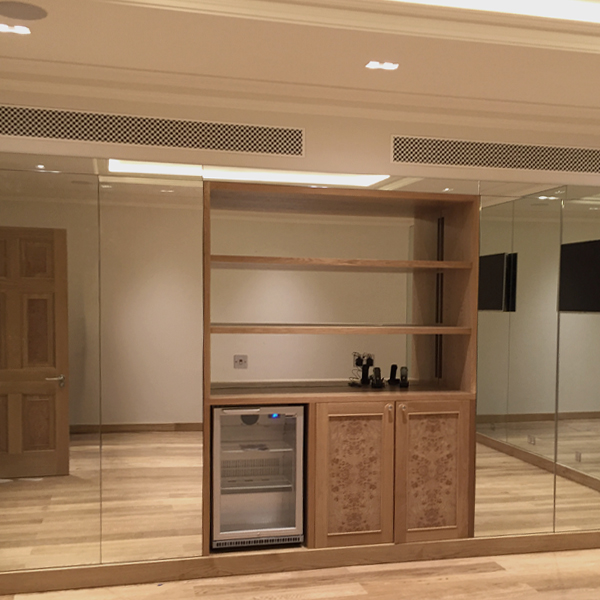 Abstract background with vertical soft wavy lines in pale green and beige tones.