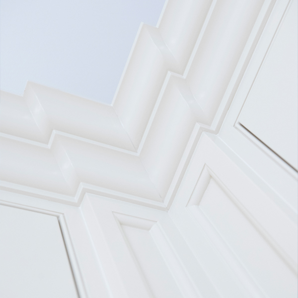 Abstract background with vertical soft wavy lines in pale green and beige tones.