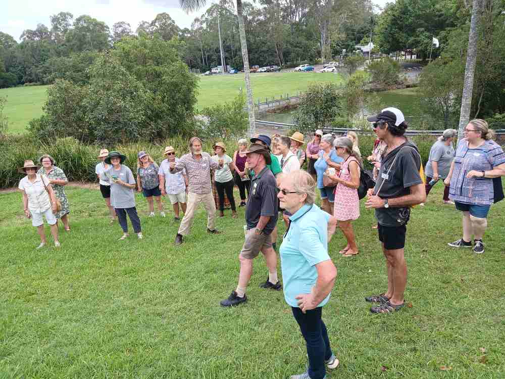 Participants gathering during a guided visit to Ediblescapes at the 2024 Community Gardens Australia National Gathering, Country Paradise Parklands, Gold Coast