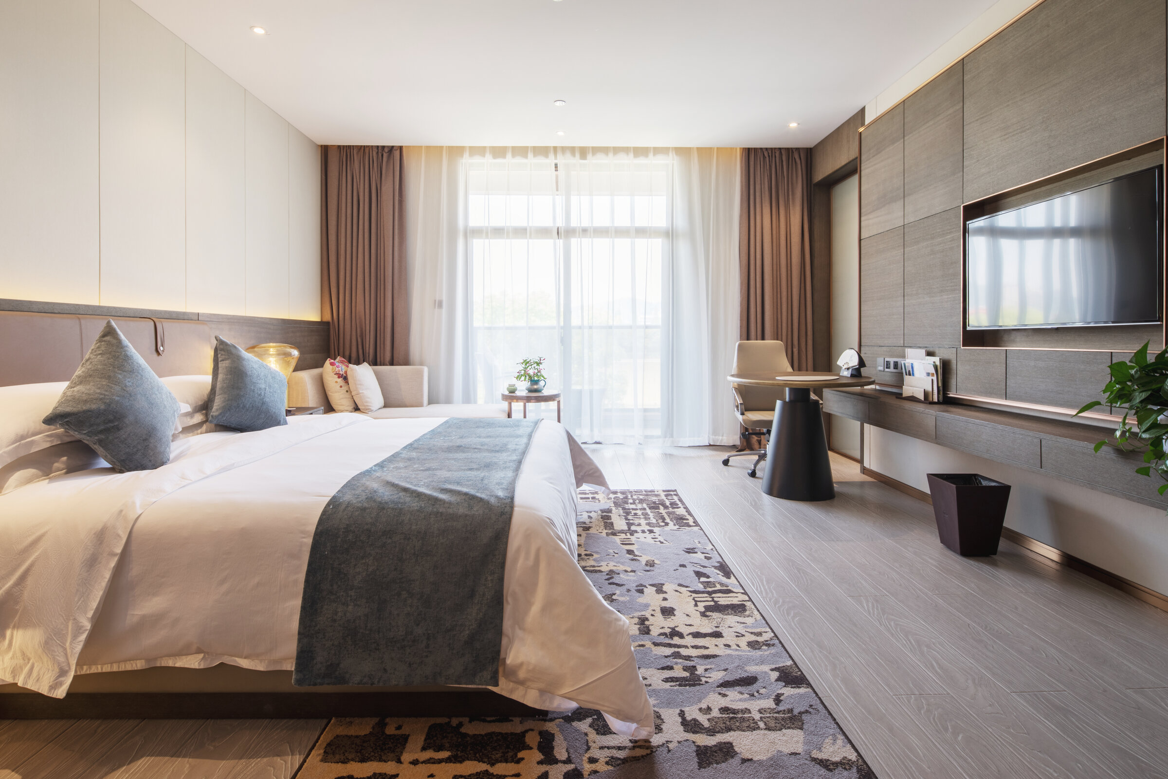 Elegant luxury hotel suite bedroom with refined contemporary styling