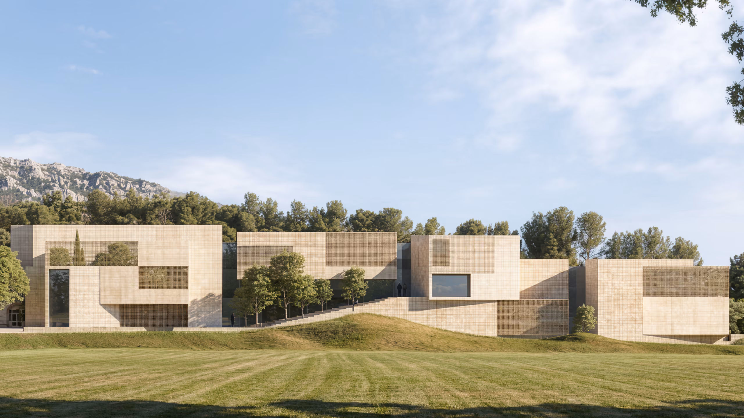 Corporate Academy in Marseille, low limestone-clad buildings with perforated screens set into a grassy hillside against pine-covered slopes
