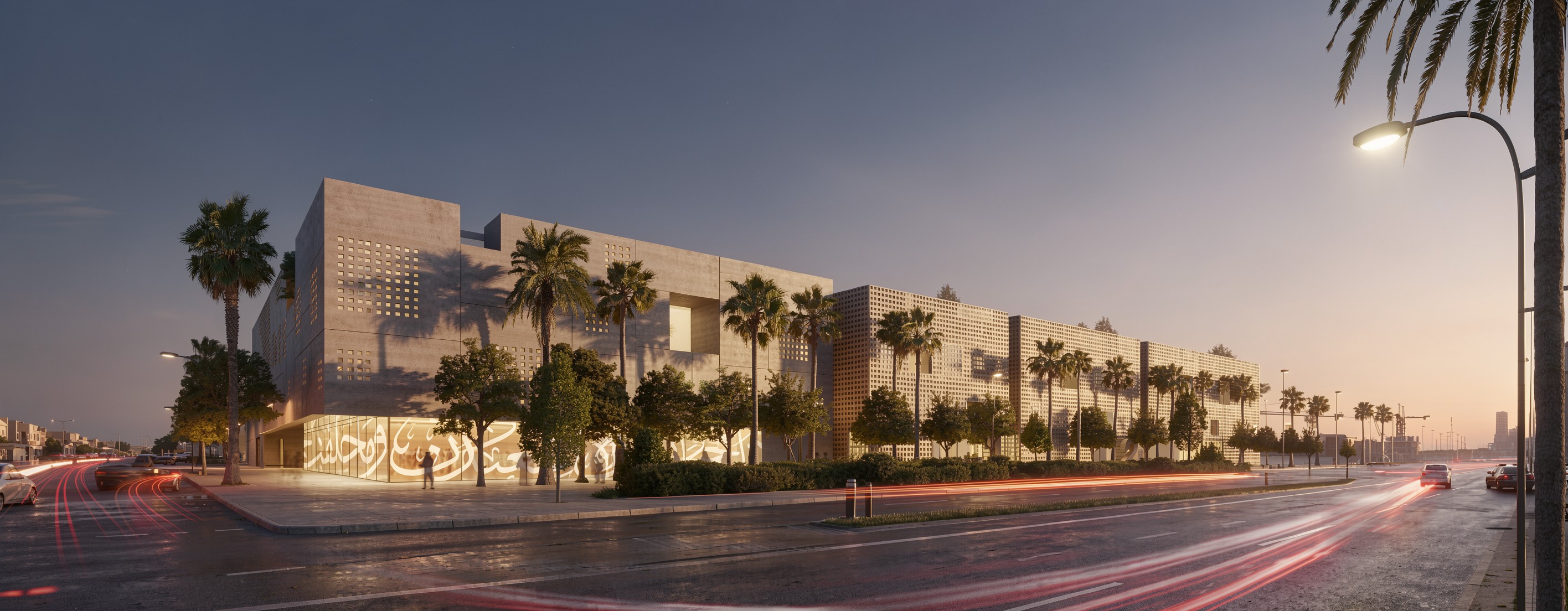 Art Oasis in Riyadh at dusk, perforated concrete facade with Arabic calligraphy screen, palm trees lining the street as car light trails pass by