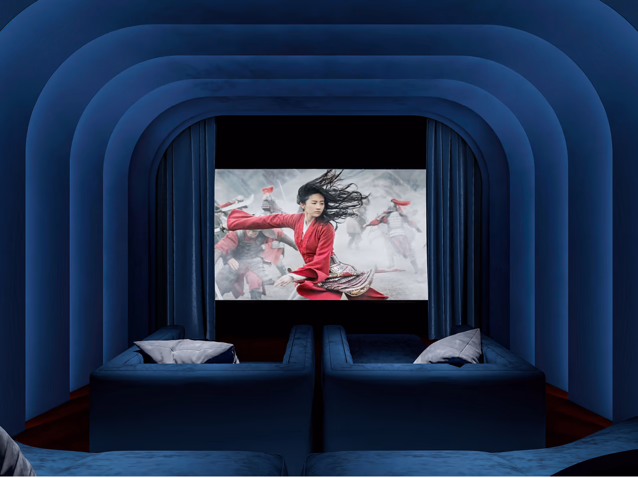 Home theatre in Nautile villa, Dubai, deep-blue upholstered walls in nested arches framing a screen and plush lounge seating