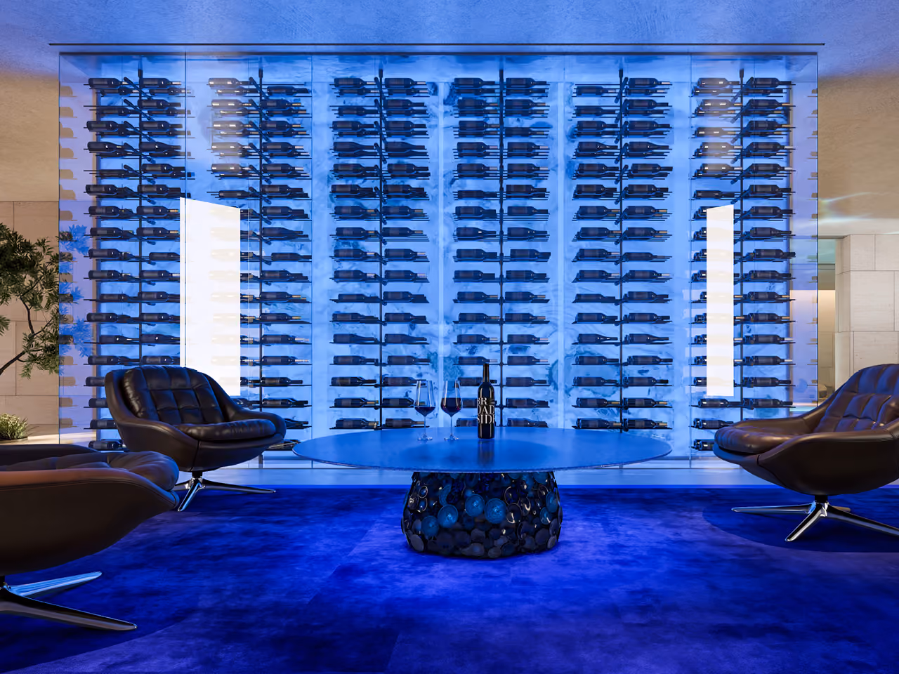 Wine lounge in the Nautile villa, Dubai, with backlit blue-hued glass wine wall, round table on a mosaic base, and swivel leather chairs on deep blue carpet