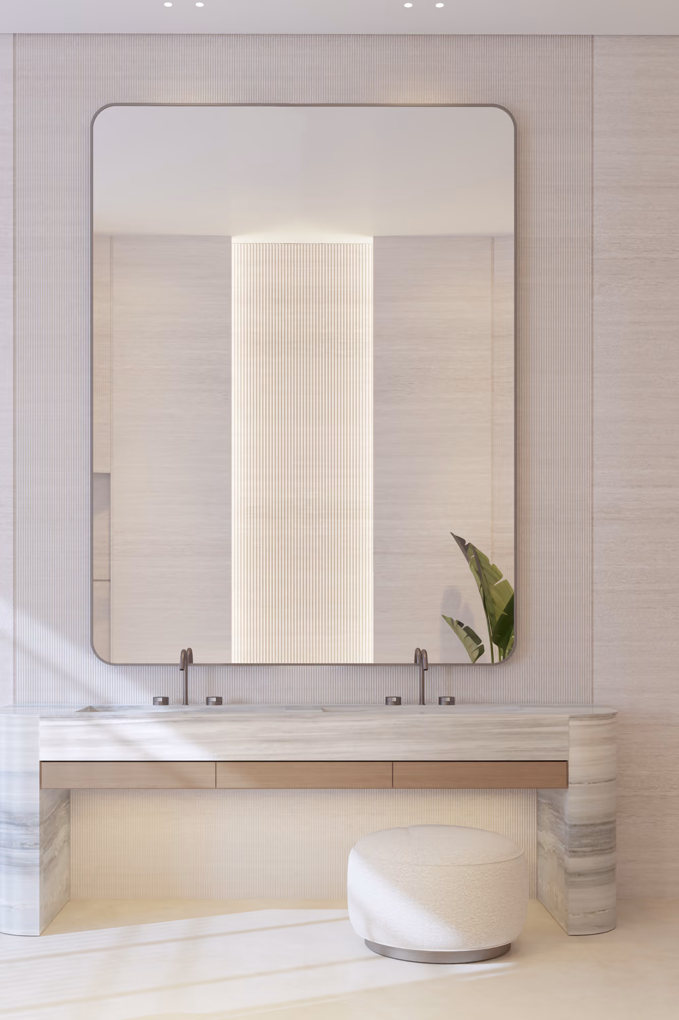 Bathroom vanity in Nautile villa in Dubai, marble double-sink counter with wood-toned drawers, large mirror and a round bouclé stool