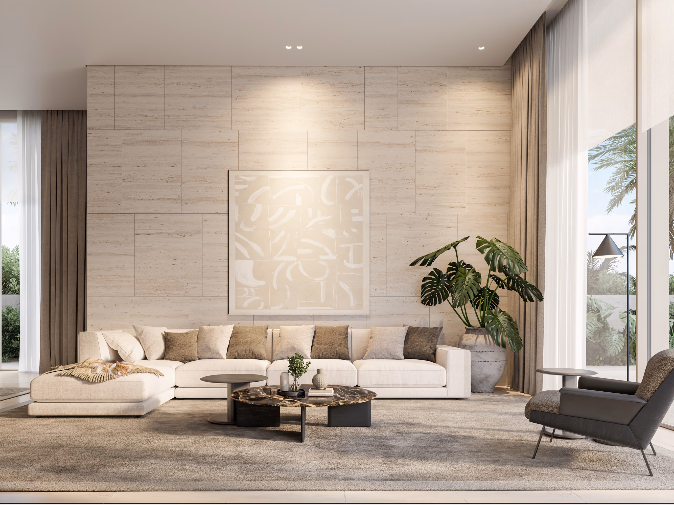 Living room in the Geode villa in Dubai, beige stone feature wall, cream sectional sofa with layered cushions, dark marble coffee tables and a large potted monstera plant