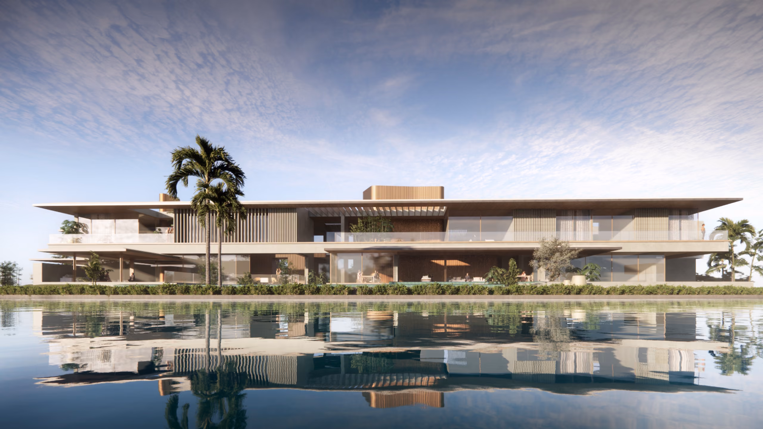 Lagoon Mansion in Dubai, long low horizontal villa with slatted timber screens and cantilevered roof, palm trees and lagoon reflecting the facade