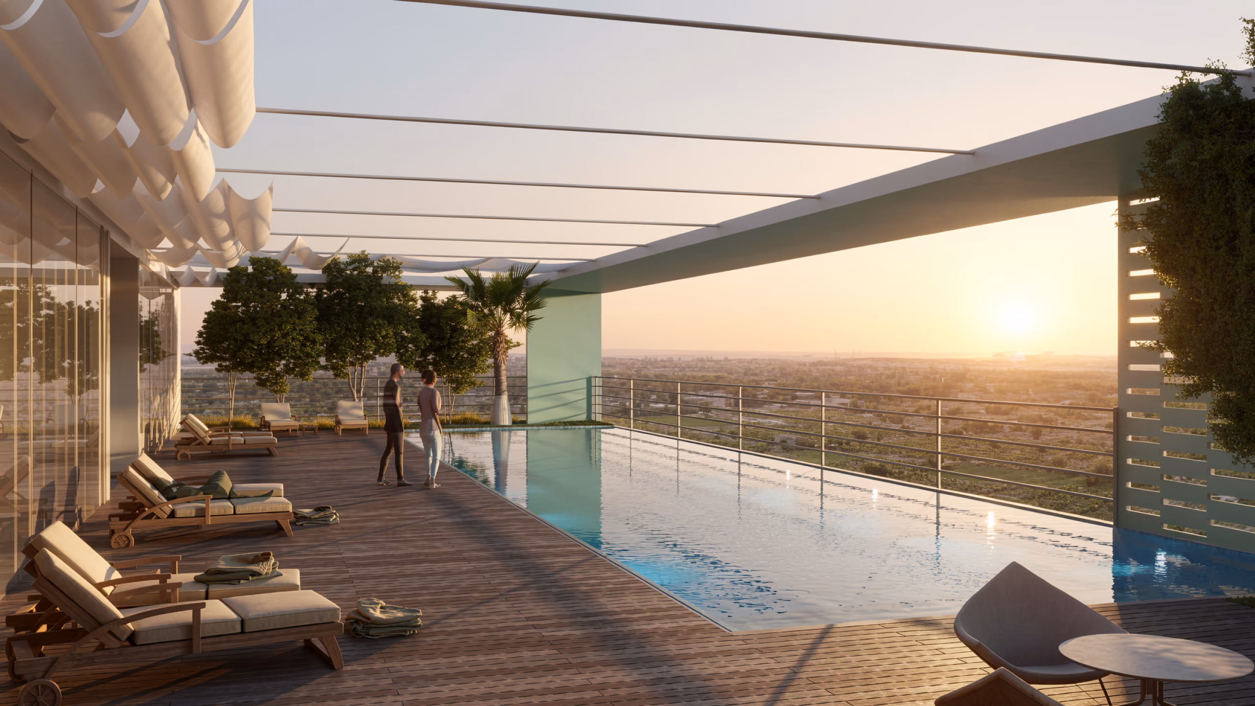 Rooftop infinity pool at Building Babylon in Babylon, loungers and pergola shading a terrace overlooking the landscape at sunset