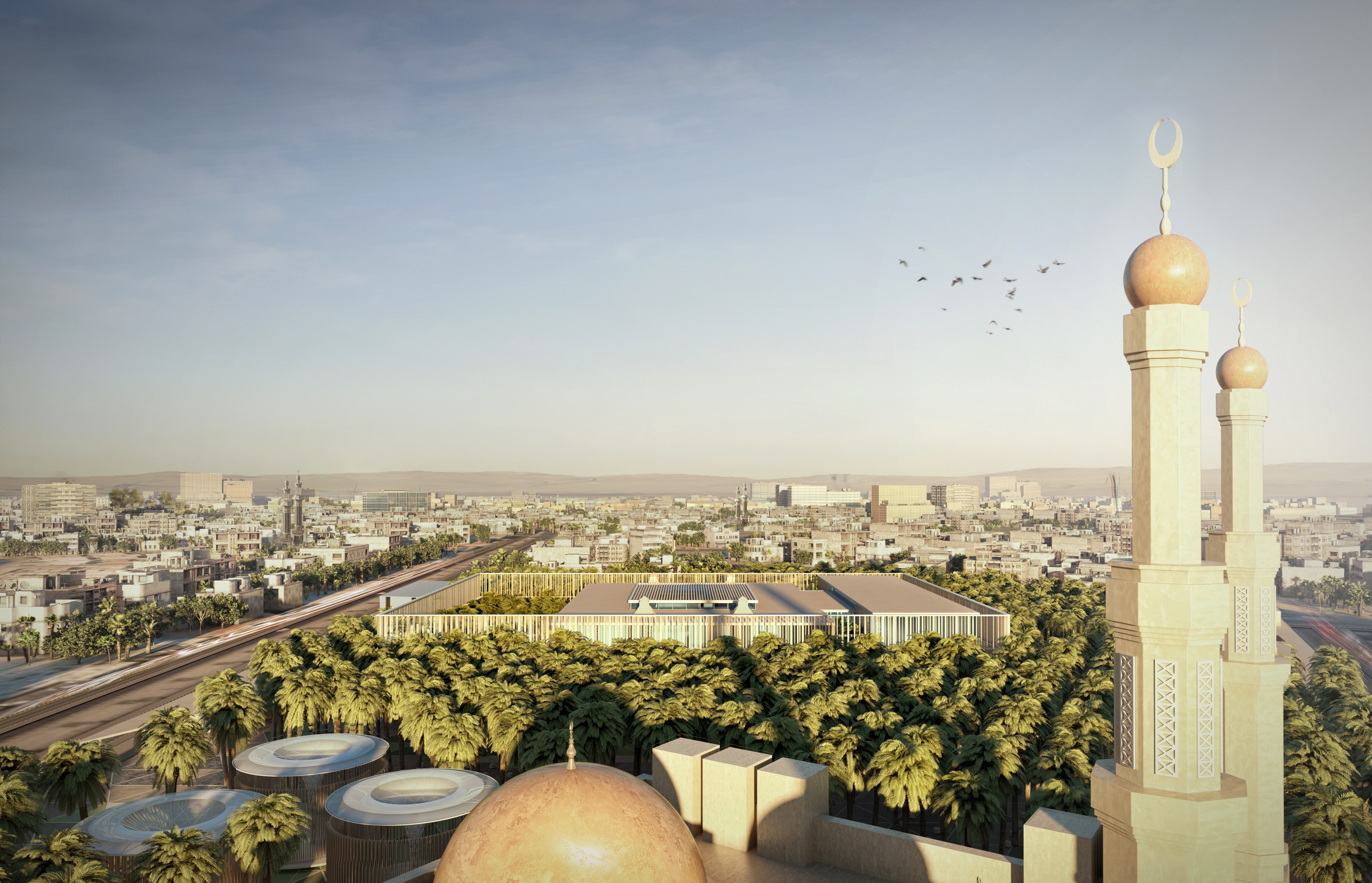 Aerial view of Dar Al Ulum Public Library in Al Jouf, its palm-shaded courtyard roof seen beyond a mosque's minarets and domes across the cityscape