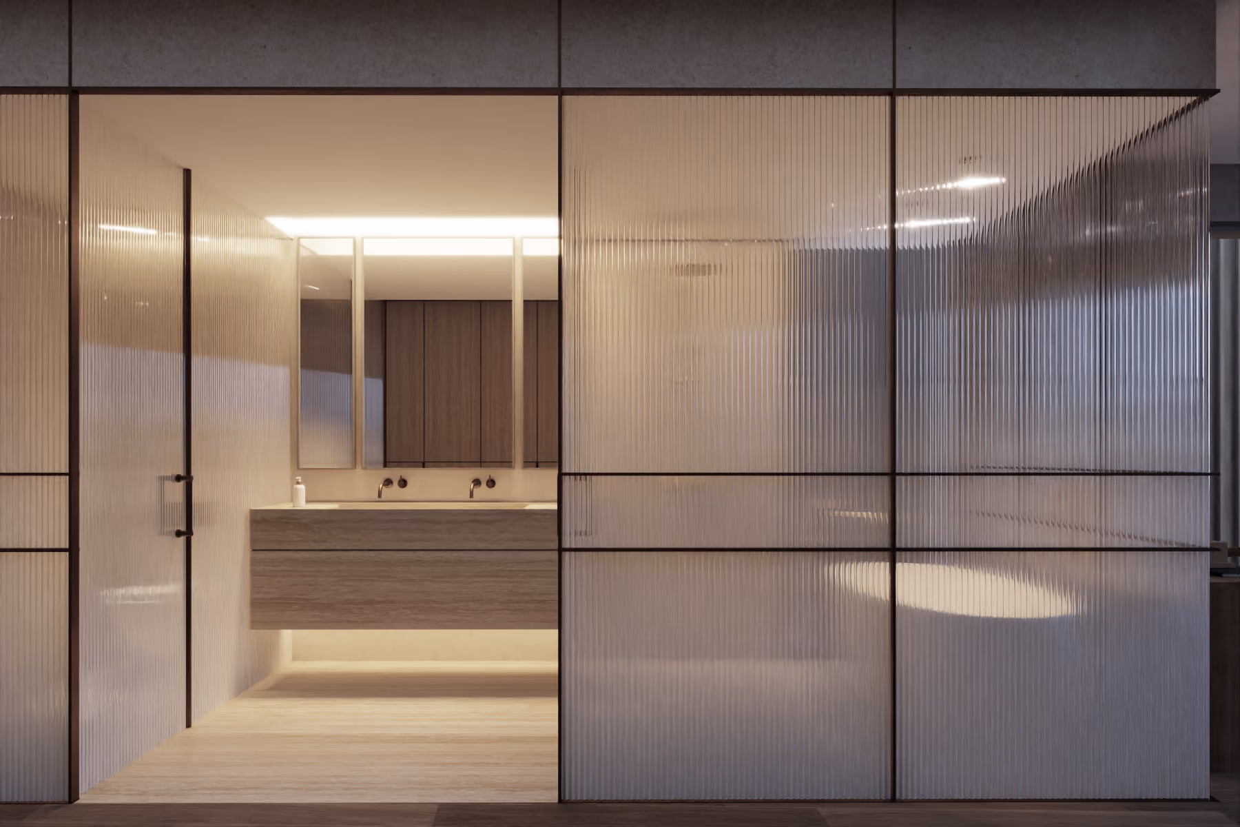 Fluted glass partitions frame a bathroom vanity with double sinks and wood-toned cabinetry in a Beach Club Townhouses interior, Dubai