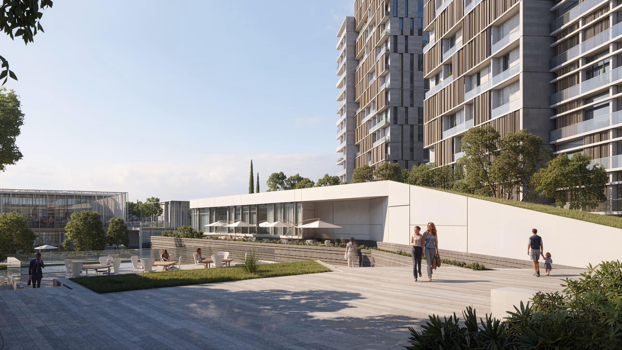 Pedestrian plaza at Uptown Park in Hazmieh, people walking past a low white pavilion with residential towers and landscaped terraces behind