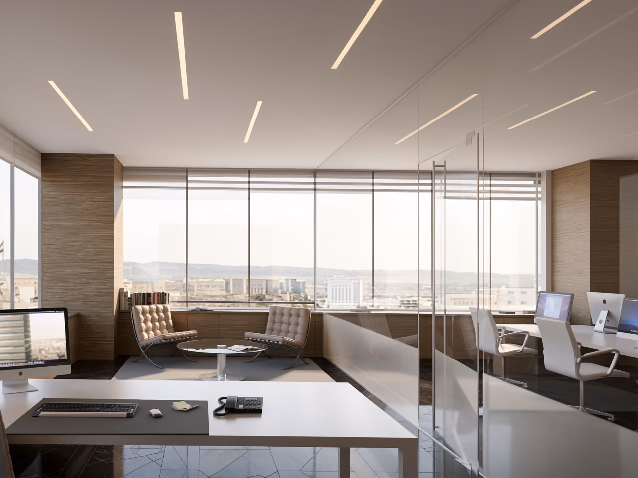 Office interior in Citadel Tower, Erbil, with glass partitions, wood-panelled walls, lounge seating and workstations overlooking the cityscape