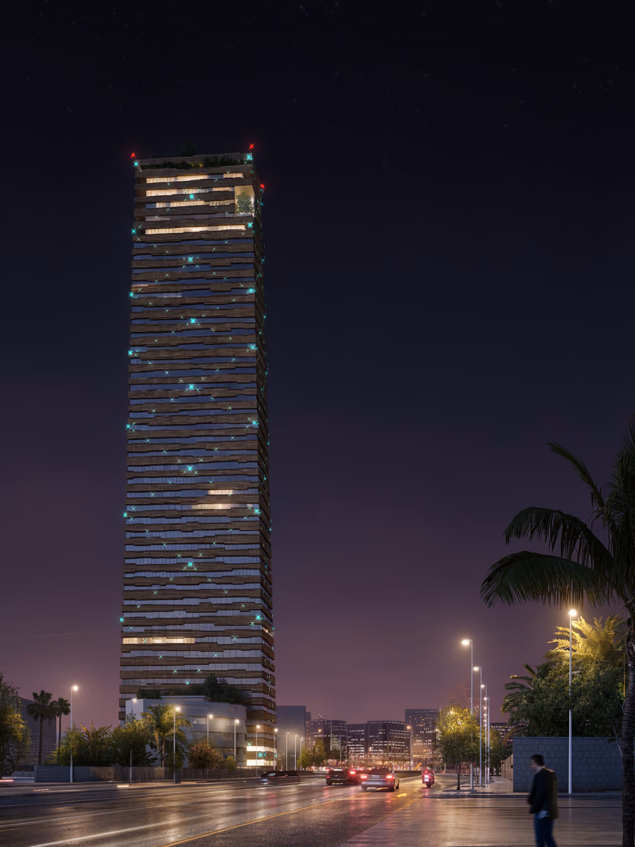 Citadel Tower rising above Erbil at night, its banded brick and glass facade illuminated with teal accent lights beside a busy palm-lined street