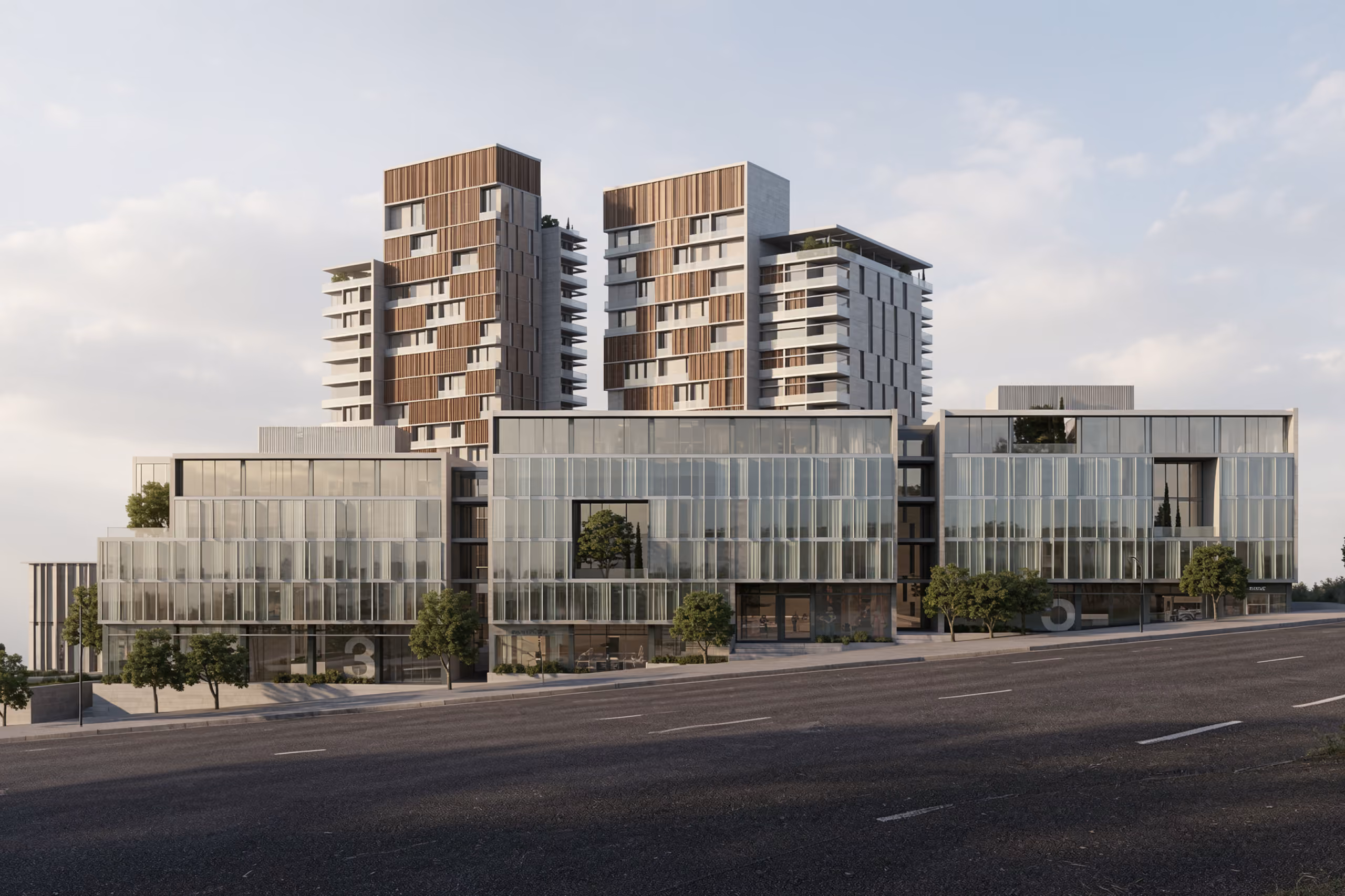 Uptown Park in Hazmieh, twin timber-clad residential towers rising above a low glass-fronted retail and office podium lined with trees