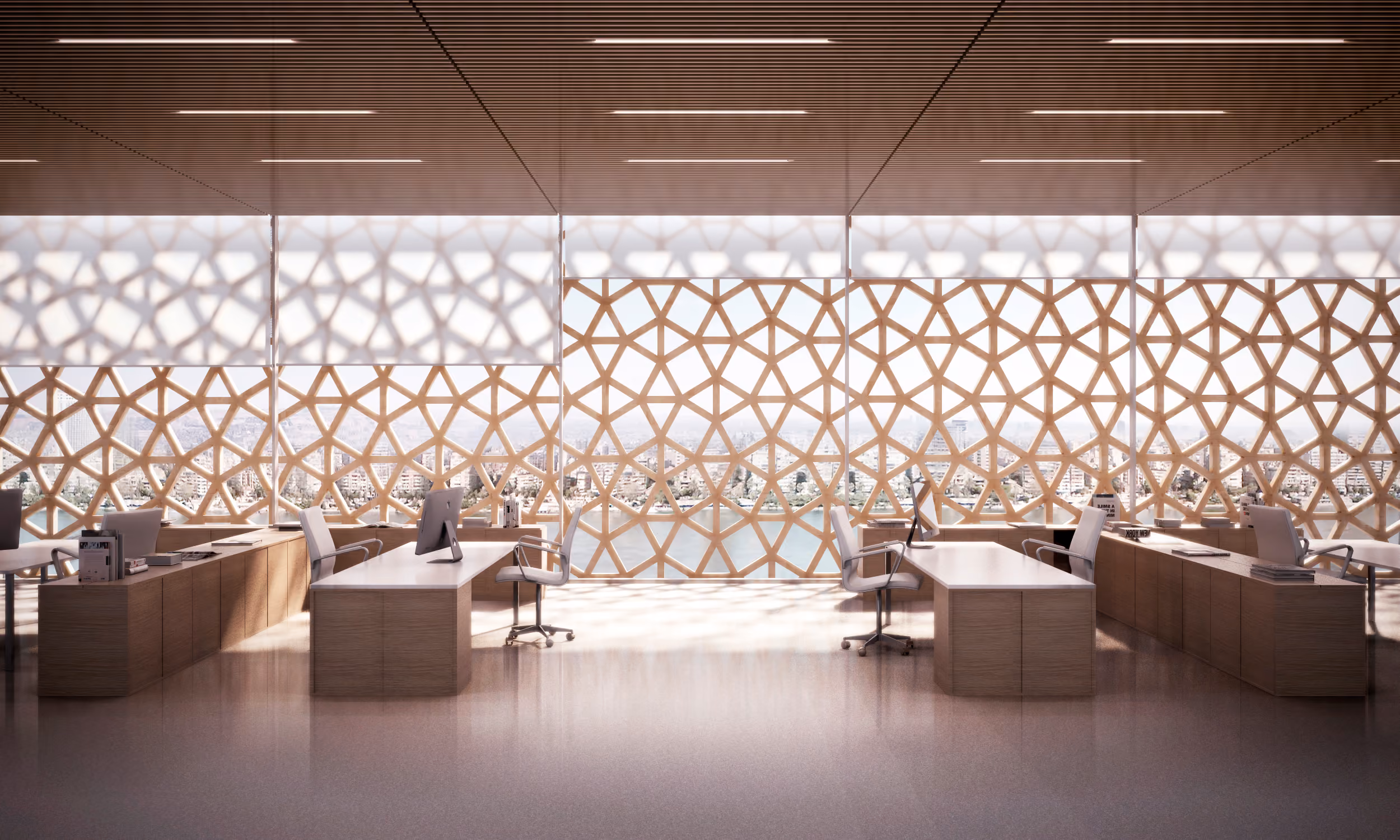 Office interior at Nile Tower in Cairo, desks facing a geometric latticed screen with river and skyline views beyond