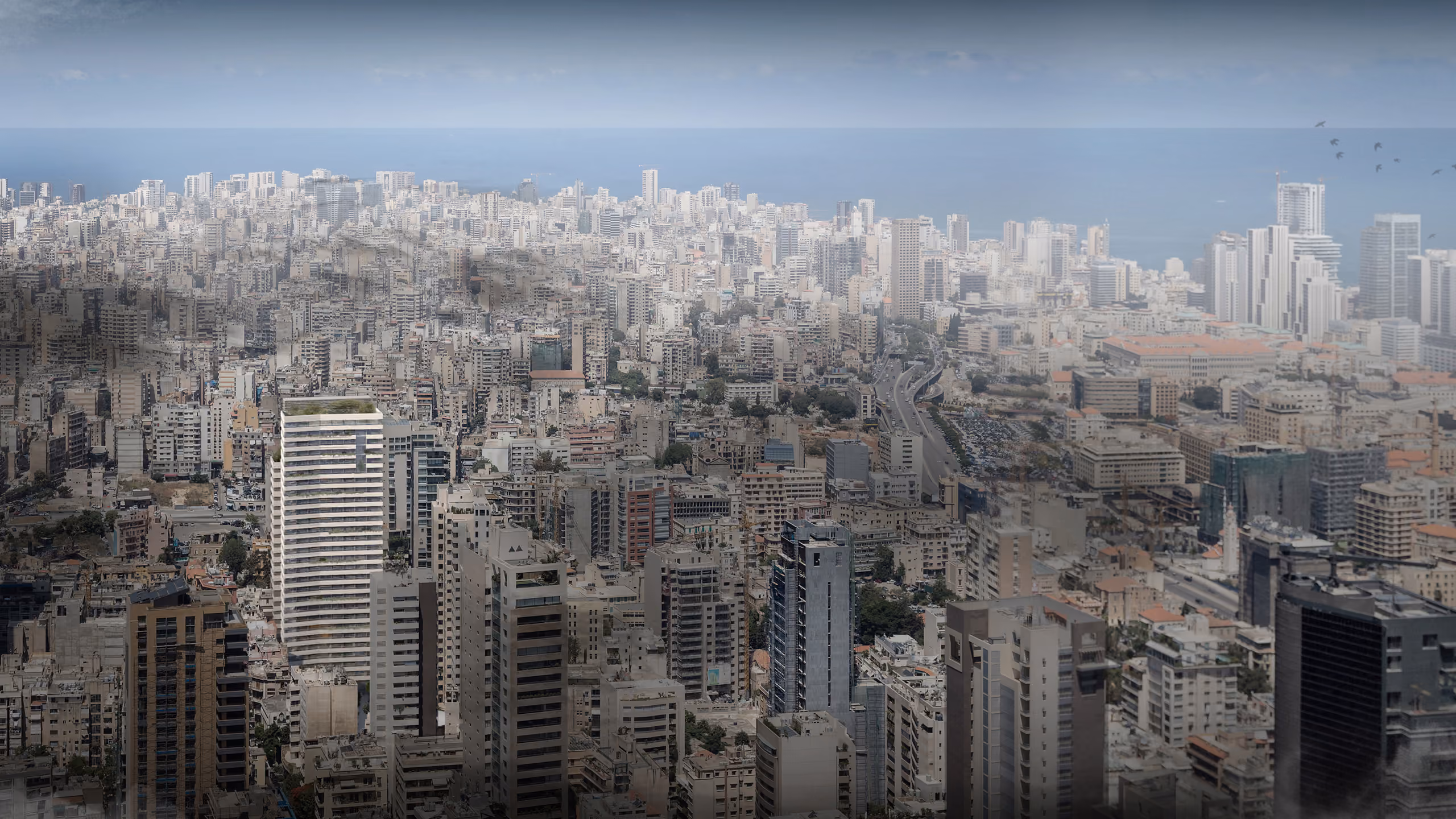 Saifi 86 in Beirut, a slender terraced tower with a green roof rising above the dense low- and mid-rise cityscape toward the sea