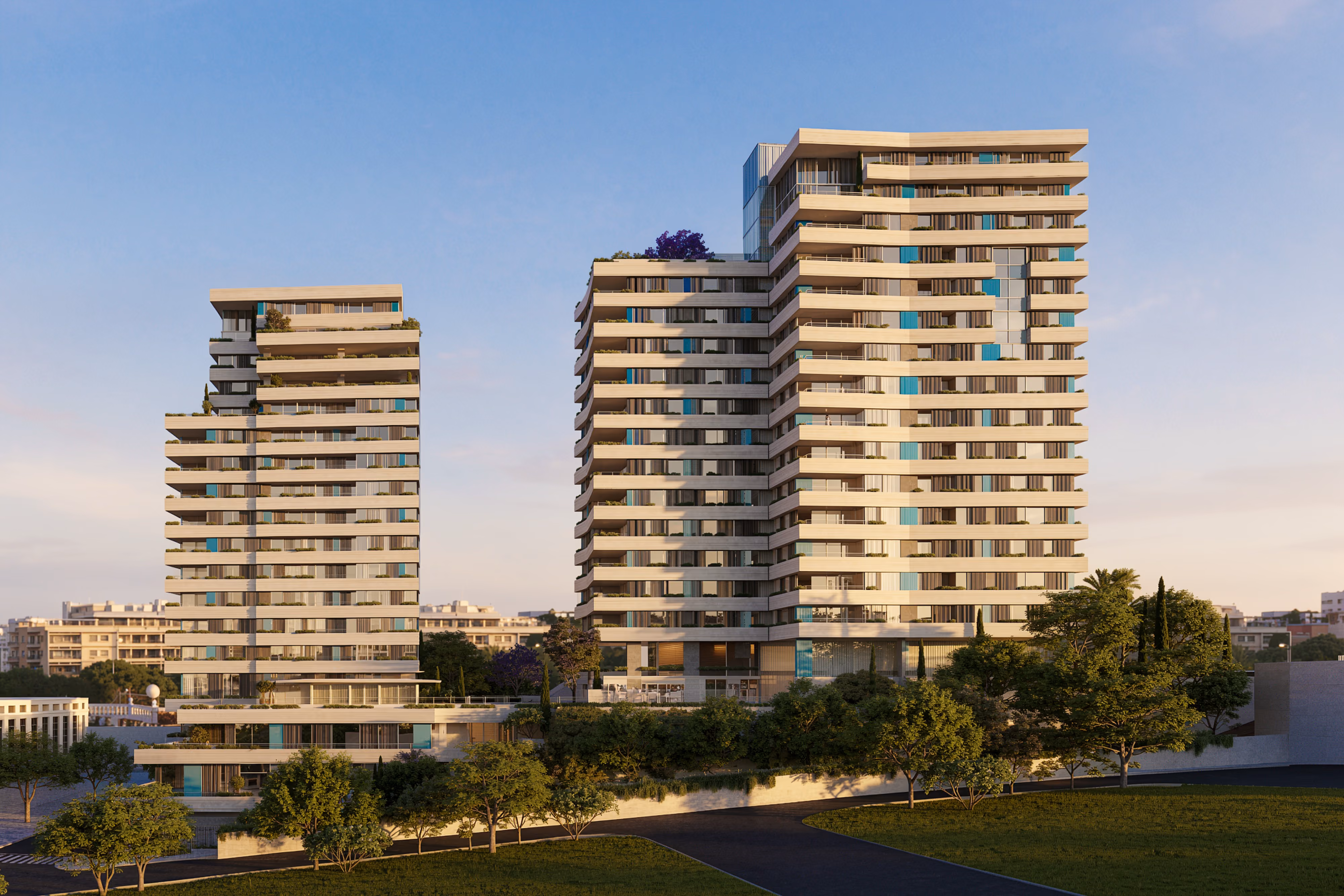 679, two residential towers of a Raouché complex in Beirut, cream-toned facades with recessed balconies and teal accents, set among landscaped grounds